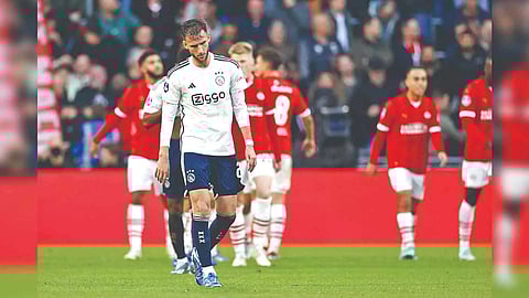 A dejected Branco van Boomen walks back after PSV scored a goal during their Dutch Eredivisie match