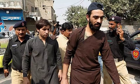 Afghan nationals are shifted to a holding centre, after Pakistan gave the last warning to undocumented migrants to leave, in Karachi (Reuters)