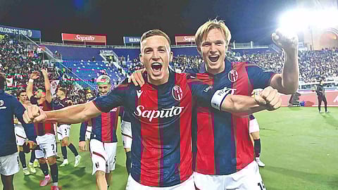 Lewis Ferguson celebrates his goal with teammate Kristiansen