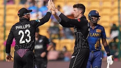 New Zealand's Mitchell Santner celebrates with teammates after taking the wicket of Sri Lanka's Angelo Mathews (PTI)&nbsp;