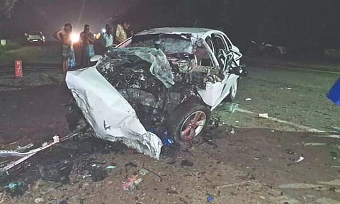 The mangled remains of the car, which rammed into a tree