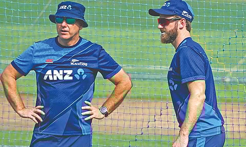 Kane Williamson interacts with coach Gary Stead
