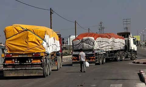 Trucks carrying humanitarian aid enter the southern Gaza Strip from Egypt via the Rafah border crossing on November 2, 2023. (AFP)