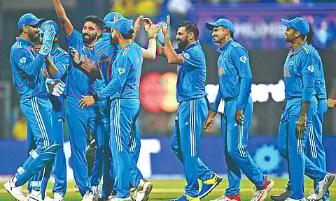 Shami celebrates with teammates after taking the wicket of Devon Conway during first semi-final