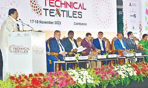 Minister for Handlooms and Textiles R Gandhi addressing a conference in Coimbatore on Friday