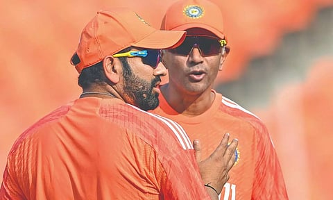 Rohit Sharma interacts with coach Rahul Dravid during a practice session