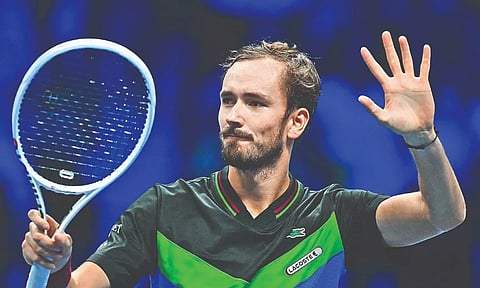Daniil Medvedev waves at fans after his match against Carlos Alcaraz