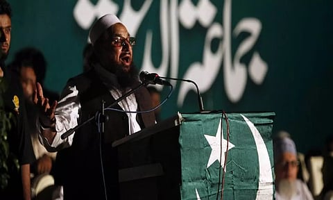 Hafiz Saeed, head of the Jamaat-ud-Dawa organisation and founder of Lashkar-e-Taiba, gestures while addressing his supporters during a convention in Karachi