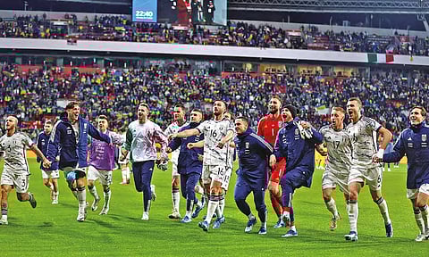 Italian players celebrate after the final whistle of their match against Ukraine that ensured its qualification