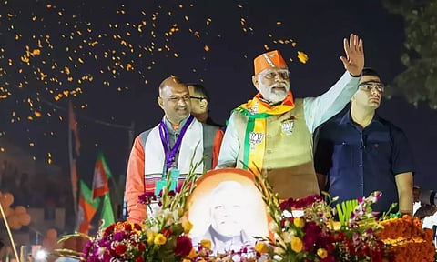 PM Modi with CP Joshi during a road show ahead of elections in Jaipur. (PTI)