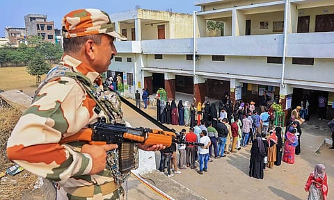 People at a polling station to cast their votes for the Rajasthan Assembly election. (PTI)