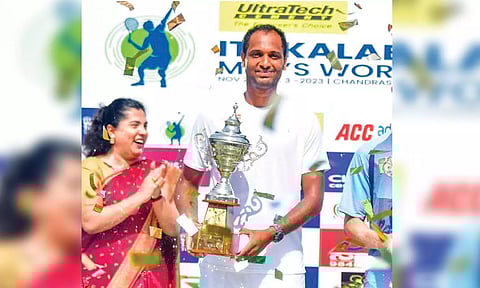 Ramkumar poses with the ITF Kalaburagi singles trophy