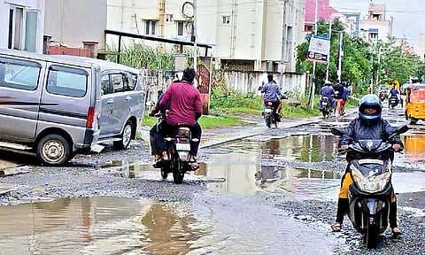 People ride over SWDs on Siva Prakasam Nagar Main Road