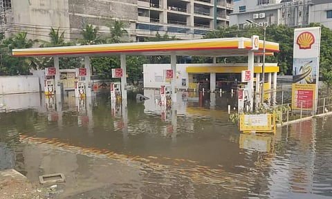A petrol pump in Pallikaranai area remains inundated and deserted as Chennai city continues to reel under massive waterlogging, facing a flood-like situation. (ANI)