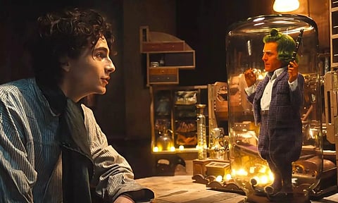 ugh Grant and Timothée Chalamet in 'Wonka' (Warner Bros)