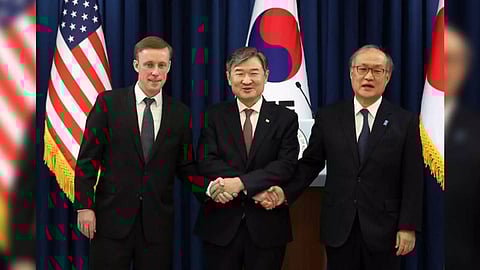 National Security Adviser Cho Tae-yong, center, shakes hands with U.S. National Security Adviser Jake Sullivan, left, and Japan's National Security Secretariat Secretary General Takeo Akiba in the press briefing room of the presidential office in Seoul
