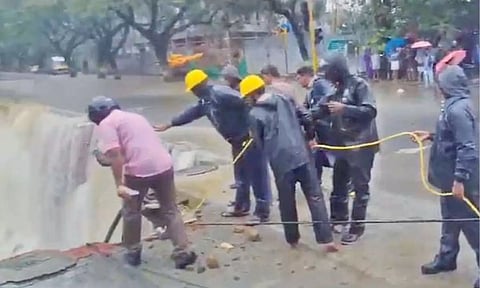 Traffic personnel during the rescue operation at the mishap site in Velachery