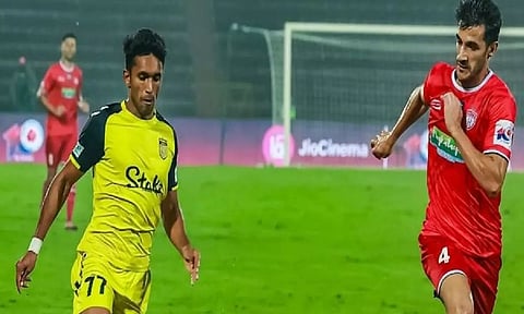 Hyderabad FC and NorthEast United FC in action