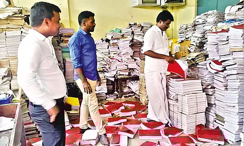 Egmore MLA I Paranthaman inspecting government records, land registration records and marriage registry at Periamet sub-registrar office on Monday