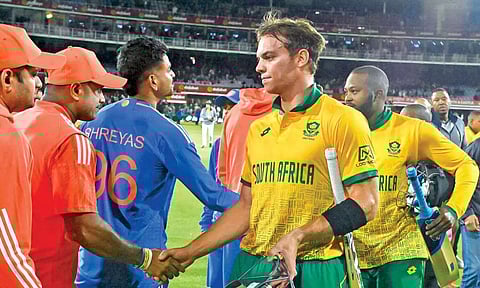 South Africa’s Tristan Stubbs and Andile Phehlukwayo shake hands with the Indian team after the second T20I