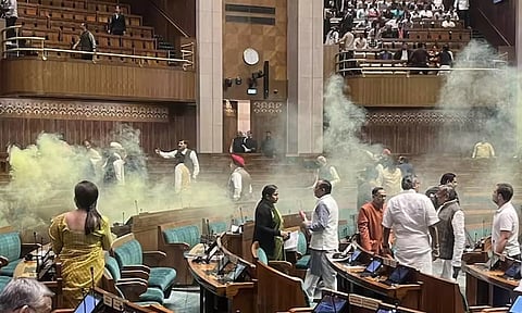 Yellow smoke fills the Lok Sabha hall following a security breach in Parliament. (X)