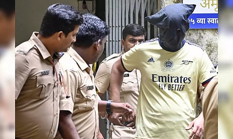 Chetan Singh Chaudhary being taken to the Magistrate court at Borivali in Mumbai. (ANI)