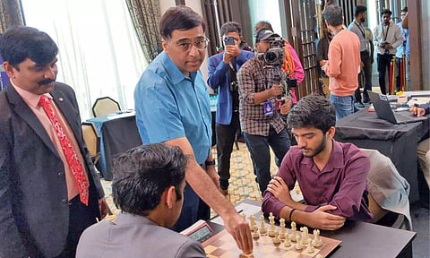 Viswanathan Anand makes the first move to kick off proceedings on day two of the competition on Saturday