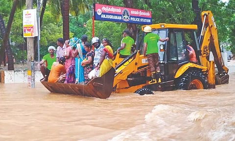 Fire and Rescue Services personnel rescue victims from inundated Nagercoil areas on Sunday.
