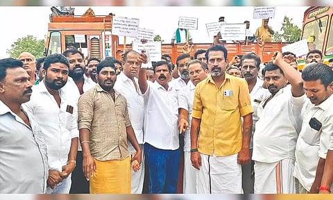 Lorry owners staging a protest in Thanjavur on Monday.