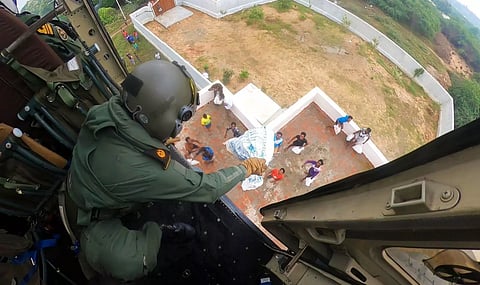 Relief kits being dropped through choppers in flood affected areas (PTI)