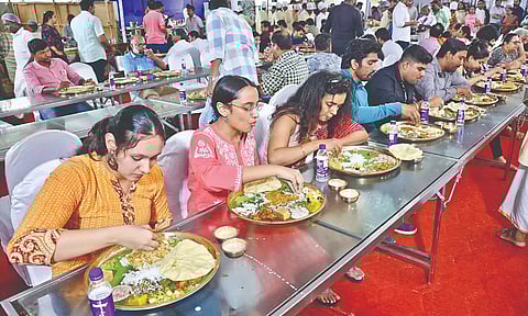 People enjoying sabha food served by Arusuvai Arasu Catering Services. (Photo credits: Manivasagan N)