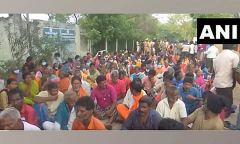 People hold a protest after Ammonia gas leak was detected in Ennore. (ANI).