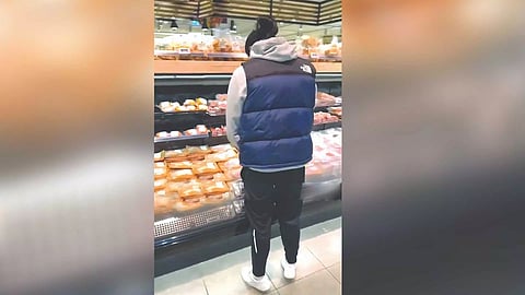 Muslim migrant urinating in the pork section of a supermarket