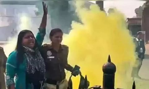 A police woman taking accused Neelam Azad away from outside the Parliament on December 13. (PTI)