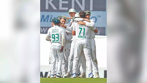 South Africa players huddle together after the victory