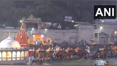 People take a holy dip in River Ganga at Har Ki Pauri (ANI)