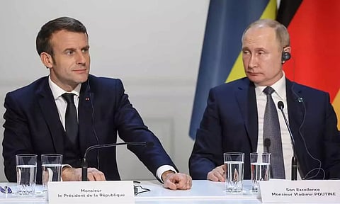 Emmanuel Macron and Vladimir Putin (Reuters)