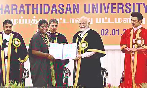 PM Narendra Modi presenting degree to a graduate at Bharatidasan University’s 38th Convocation in Tiruchy on Tuesday