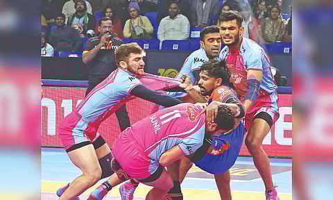 Haryana’s Chandran Ranjit is being tackled by Jaipur Pink Panthers