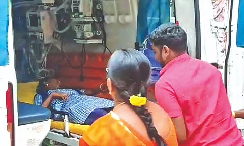 The girl being moved into an ambulance after suicide bid