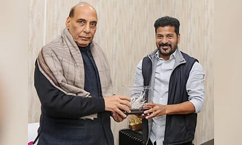 Telangana CM A Revanth Reddy with Union Defence and Finance Ministers Rajnath Singh. (PTI)