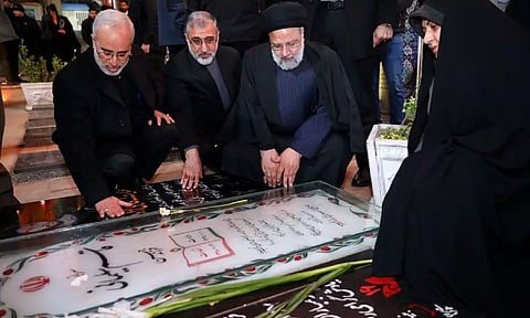 Iran's President Ebrahim Raisi visits the grave of Iranian military commander General Qassem Soleimani