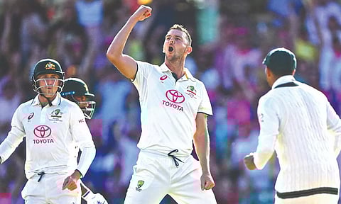 Josh Hazlewood celebrates taking the wicket of Sajid Khan