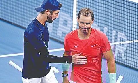 Jordan Thompson (L) and Rafael Nadal gesture after the former’s win
