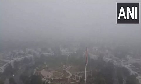 Drone visuals from Connaught Place show fog grips the national capital amidst cold waves (ANI)