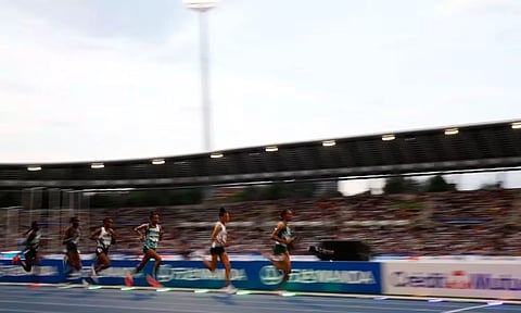 Tigist Ketema in action with athletes during the women's 5000m (Reuters)