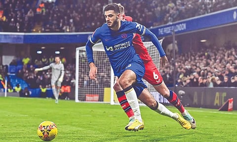 Chelsea’s Armando Broja dribbles the ball past Preston’s Liam Lindsay during their match at Stamford Bridge