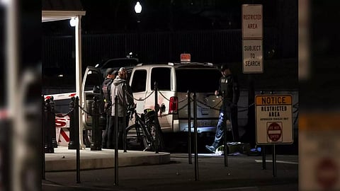 Members of the US Secret Service check site of a vehicle crash on a perimeter gate of the White House (Reuters)