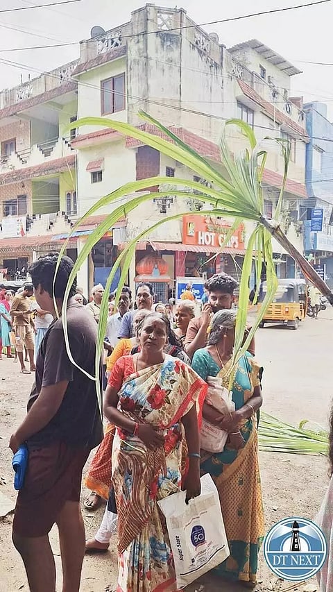 People queuing outside a PDS shop in Chetpet to collect their Pongal gift hamper and cash of Rs.1000