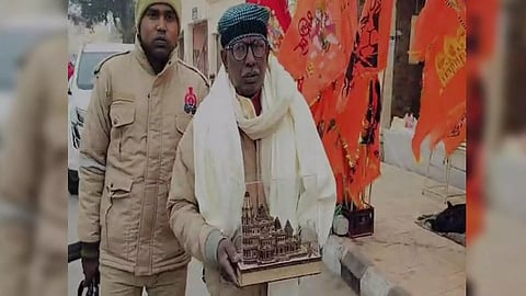 Iqbal Ansari with miniature idol of Ram temple (ANI)